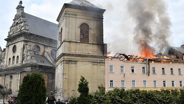 Fire and smoke rise above Lviv city centre after a Russian drone attack on Tuesday.