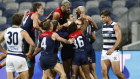 Celebration time: Max Gawn is mobbed after kicking the match-winning goal after the siren.