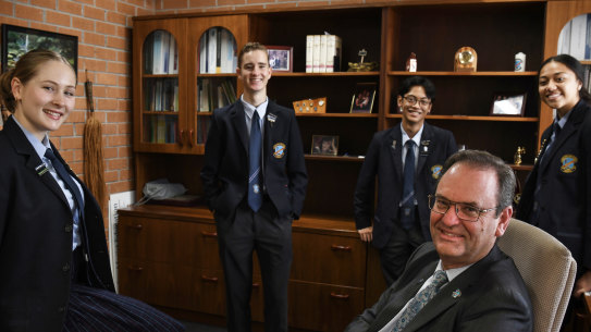 Steve Lo Cascio, principal of Mount Carmel Catholic College in Varroville, with students