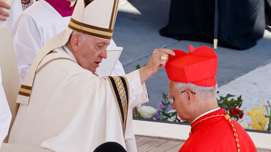 In 2023, newly elected Cardinal Robert Francis Prevost received his biretta from Pope Francis at the Vatican.