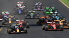 Drivers make a start after lights out.