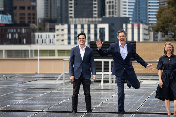 Mooney Valley council candidate Pierce Tyson, Lord Mayor candidate Nick Reece and Port Phillip council candidate Heather Consulo at the solar array on top of Wilson Hall at the University of Melbourne.