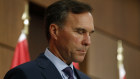 Bill Morneau announces his resignation at a news conference in Ottawa.