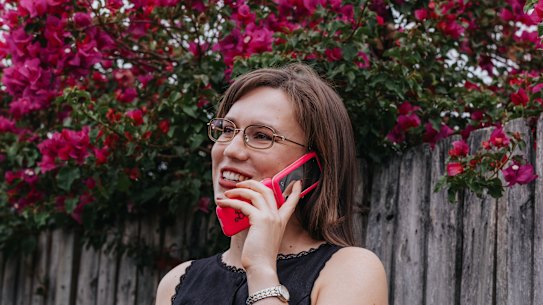 Fifth-year law student and paralegal Lucy Long uses a Barbie flip phone. 