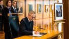 Australian Prime Minister Anthony Albanese signs the Queen’s book of condolences at Parliament House, Canberra on September 9.