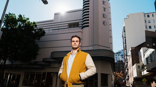 Dulcie's Kings Cross owner Brandon Martignago outside the old Minerva theatre, which he says should be re-opened.