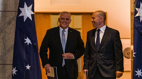 Treasurer Josh Frydenberg and Australian Prime Minister Scott Morrison post budget  television interviews in the Prime Minister’s courtyard. 