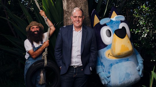 “We upset all sides of politics, simply by holding people to account,” says ABC boss David Anderson, here with Gardening Australia host Costa Georgiadis and Bluey.
