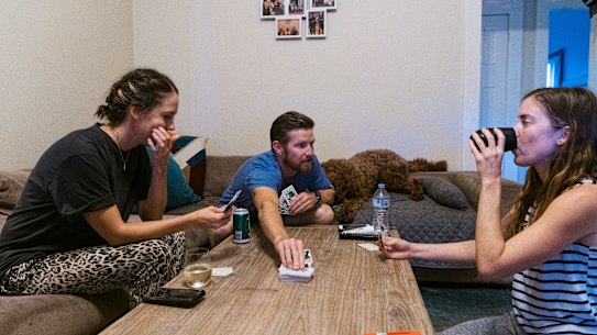 Flatmates Emily Logan, Chris Jackson and Brienna Anderson at home in Coogee.
