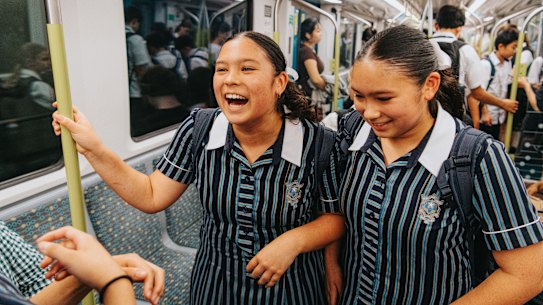 Elly and Imogen Wagener enjoy the ride to school on the metro, thanks to their parents’ foresight.