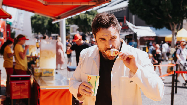 Boys pairs cheese on a stick with a fresh lemonade.