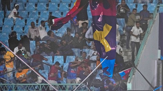 Strong winds saw stadium banners crash among spectators in Lucknow.