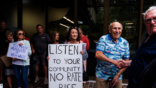 Protesters gather outside the Northern Beaches Council meeting.