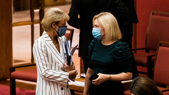 Attorney-General Michaelia Cash speaks to Liberal senator Amanda Stoker on Thursday.