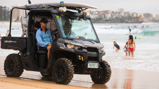 Northern Beaches Council Lifeguards James Thomson and Scotty Atherton with the Manly SLSC’s ATV (all terrain vehicle) and rescue boards which along with the flags and Lifeguards themselves, will be fitted with GPS and other monitoring devices to collect  more accurate data that will improve their ability to staff the beach, and prevent fatal drownings. 