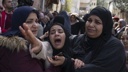 Palestinian Hadeel Abu Atiyeh, cries during the funeral of her brother Sanad Abu Atiyeh, 17, in the West Bank refugee camp of Jenin, Israel.