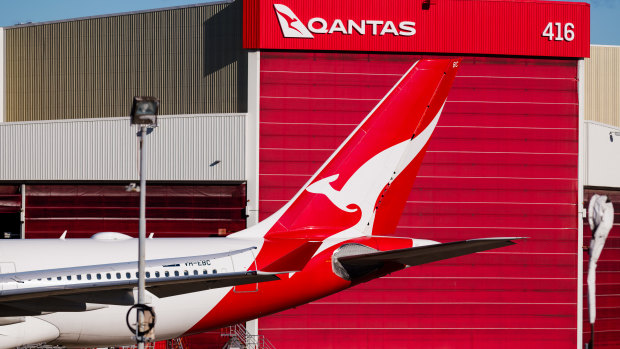 Qantas lifts investment in planes, customer service as profits fall