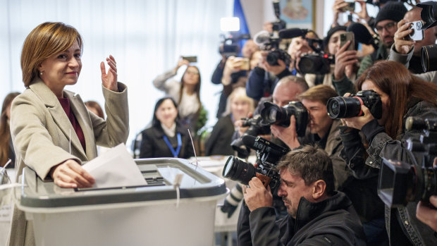 Moldova’s President Maia Sandu prepares to cast her vote, in Chisinau.