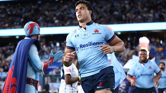 Waratahs star Joseph Aukuso-Suaalii takes the field at Allianz Stadium.