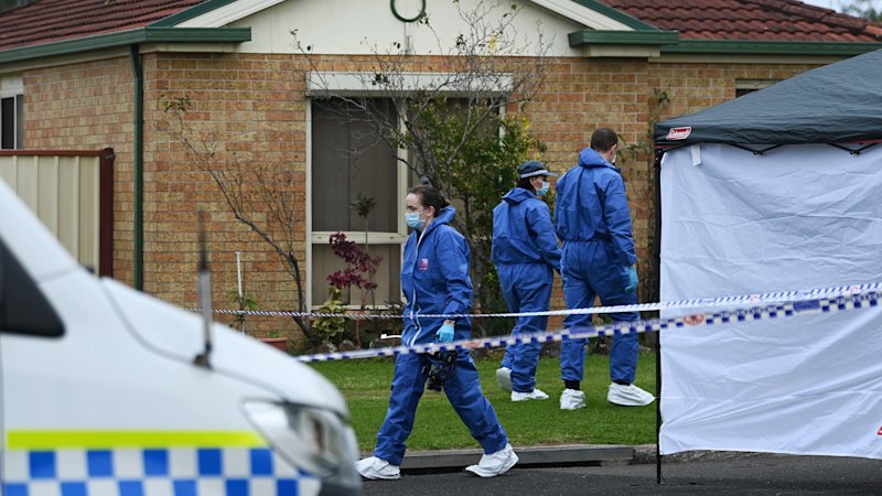 Arrest after man found dead outside burnt Sydney house