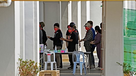 Indonesian trafficking victims wait to be processed at the Thai border after being released.