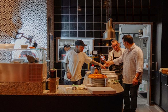The pizzas are cooked in a dual wood fire-and-gas oven.