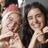 Hannah Brown and Selena Cardillo, both 21, passed the time waiting to buy Taylor Swift tickets by making bracelets of Swift’s song lyrics and titles.