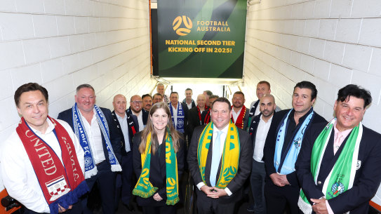 Football Australia chief executive James Johnson and Natalie Lutz, FA’s since-departed head of professional football and competitions, with representatives of the second division’s eight foundation clubs.