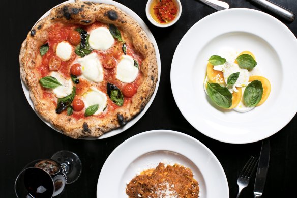 Margherita pizza and burrata caprese salad. 