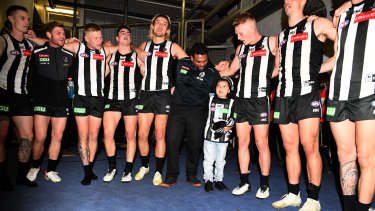 Well played: Collingwood gave young cancer sufferer Kyron McGuire the night of his life in their win over Port Adelaide.