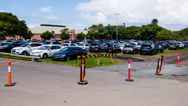Vehicles parked on fields opposite the Hordern Pavilion at Moore Park during an event.