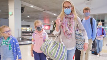 Edwina Rouse and her four children arrive from Sydney into Melbourne on Saturday morning. 