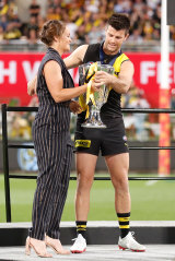 Ash Barty presents the AFL Premiership Cup 2020 to Trent Cotchin in Brisbane.
