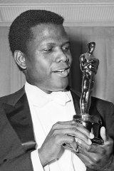 Sidney Poitier with his Oscar for best actor for his role in Lillies of the Field. He was the first black actor to win the award.
