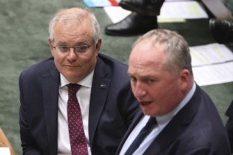 Prime Minister Scott Morrison, left with Barnaby Joyce, told Parliament on Monday he would stick with the target that he took to the 2019 election.