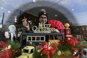 Christmas wonderland - in July. Danny Harb, owner of st.derby cafe in Pascoe Vale, with his window display. 