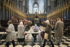 People arrive to receive their COVID-19 vaccine in Westminster Abbey, London. 