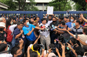 Protest leader Parit “Penguin” Chiwarak outside the criminal court in Bangkok after his release on bail on August 15.