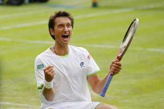 Sergiy Stakhovsky of Ukraine reacts as he wins against Roger Federer of Switzerland in their men’s second round singles match at Wimbledon in 2013.