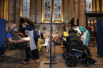 Patients receive doses of the Pfizer vaccine.