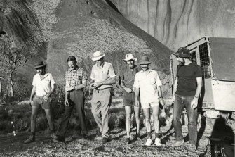 Henry Huggins (second from left) at the Azaria Chamberlain site near Uluru in February 1986.