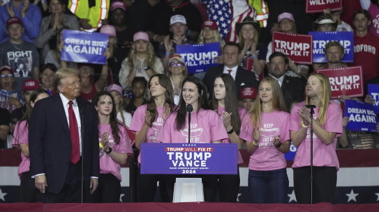 Members of the Roanoke College swim team support Donald Trump at a rally in Salem, Virgina.
