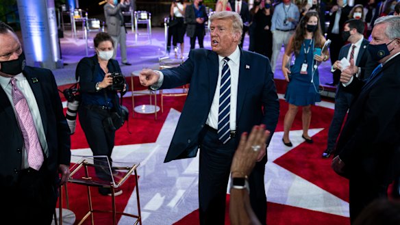 President Donald Trump talks with voters after his town hall in Miami.