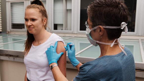 Sydney GP Allison Bielawski gives a flu shot to patient Lily Bardsley on Monday.