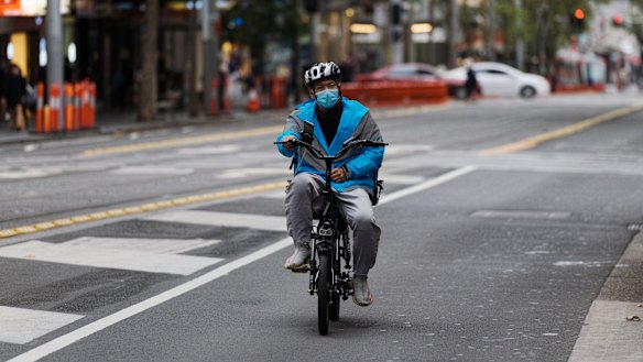 A food-delivery cyclist working during the coronavirus lockdown in Sydney's  CBD this week.