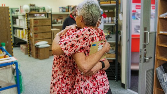 Ms Hunt received a gift from a staff member, whom she hugged straight after.