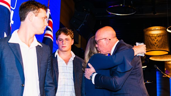 Peter Dutton with his wife, Kirilly, and sons after addressing the crowd at the election night function in Brisbane.