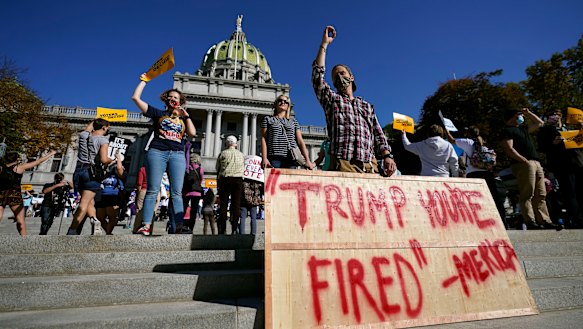 People are jubilant as they gather outside the Pennsylvania State Capitol.