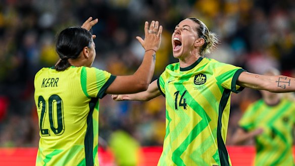 Alanna Kennedy celebrates with Sam Kerr after scoring against New Zealand in December.
