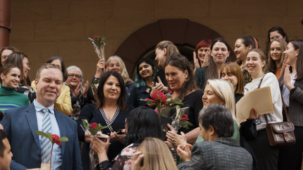 MPs celebrate with abortion advocates after the bill was passed.
